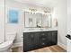 Tastefully updated bathroom featuring dual sinks, modern fixtures, and stylish tile at 4902 E Golden St, Mesa, AZ 85205