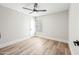 Cozy bedroom with light-colored walls and laminate floors with a modern ceiling fan at 4902 E Golden St, Mesa, AZ 85205