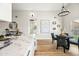 An open dining area featuring modern chandelier and a marble countertop island at 4902 E Golden St, Mesa, AZ 85205