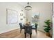Cozy dining area with modern lighting and a decorative painting adorning the wall at 4902 E Golden St, Mesa, AZ 85205