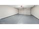 Clean and well-maintained garage with epoxy flooring and a white garage door at 4902 E Golden St, Mesa, AZ 85205
