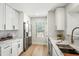 Modern kitchen with white cabinets, stainless steel appliances, and marble countertops perfect for cooking at 4902 E Golden St, Mesa, AZ 85205