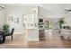 Spacious living area featuring open layout to backyard, seamlessly connecting dining, kitchen, and living spaces at 4902 E Golden St, Mesa, AZ 85205