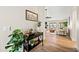 Open-concept living room with fireplace and wood floors at 4902 E Golden St, Mesa, AZ 85205
