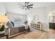 Light-filled main bedroom featuring a vaulted ceiling and modern ceiling fan at 4902 E Golden St, Mesa, AZ 85205