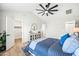 Main bedroom with vaulted ceiling, ceiling fan, and access to a walk-in closet at 4902 E Golden St, Mesa, AZ 85205