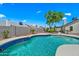 Sparkling pool with lush landscaping provides a private backyard retreat, ideal for hot summer days at 4902 E Golden St, Mesa, AZ 85205