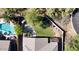 Aerial view of backyard with pool, patio furniture, manicured lawn, and mature landscaping providing privacy at 5090 E Sleepy Ranch Rd, Cave Creek, AZ 85331
