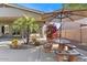 Inviting backyard patio with table, umbrella, and palm trees for outdoor living at 5090 E Sleepy Ranch Rd, Cave Creek, AZ 85331