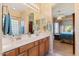 Bathroom featuring double sinks and vanity with access to the main bedroom at 5090 E Sleepy Ranch Rd, Cave Creek, AZ 85331