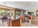 Spacious kitchen with a breakfast bar, stainless steel appliances, granite countertops, and tile flooring at 5090 E Sleepy Ranch Rd, Cave Creek, AZ 85331