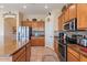 Functional kitchen featuring stainless steel appliances, wooden cabinets, granite countertops, and tile flooring at 5090 E Sleepy Ranch Rd, Cave Creek, AZ 85331