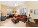 Comfortable living room with natural light, plush seating, and ceiling fan at 5090 E Sleepy Ranch Rd, Cave Creek, AZ 85331