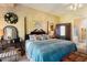 Comfortable main bedroom with a four-poster bed, ensuite, and soft decor at 5090 E Sleepy Ranch Rd, Cave Creek, AZ 85331