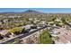 Scenic view of a desert neighborhood nestled near mountains with a variety of home styles and natural landscaping at 5090 E Sleepy Ranch Rd, Cave Creek, AZ 85331