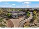 Estate home with mountain views, mature desert landscaping and a paver driveway at 6535 W Gold Mountain Pass, Phoenix, AZ 85083