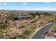 Stunning aerial view of desert landscaped luxury homes with mountain views in Scottsdale, Arizona at 6535 W Gold Mountain Pass, Phoenix, AZ 85083