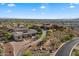 Expansive aerial view of luxury home showcasing desert landscaping, and mountain views in Scottsdale at 6535 W Gold Mountain Pass, Phoenix, AZ 85083