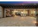 Expansive back patio with comfortable seating, dining area, and elegant pergola at 6535 W Gold Mountain Pass, Phoenix, AZ 85083