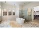 Primary bathroom features a large soaking tub and a walk-in shower at 6535 W Gold Mountain Pass, Phoenix, AZ 85083