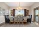 Dining area features views, large table, chairs and decorative chandelier at 6535 W Gold Mountain Pass, Phoenix, AZ 85083