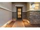 Close-up of front door with decorative wrought iron, stone accents, and pathway lighting at 6535 W Gold Mountain Pass, Phoenix, AZ 85083