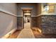View through the front door into home entry featuring stone accents and pathway lighting at 6535 W Gold Mountain Pass, Phoenix, AZ 85083