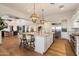 Bright kitchen features a generous island with bar seating, stainless appliances, and an open layout perfect for gatherings at 6535 W Gold Mountain Pass, Phoenix, AZ 85083