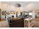 Open-concept living room featuring a fireplace, vaulted ceiling and hardwood floors at 6535 W Gold Mountain Pass, Phoenix, AZ 85083