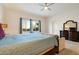 Bedroom features a king bed, seating area and dresser at 6535 W Gold Mountain Pass, Phoenix, AZ 85083