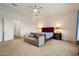Relaxing main bedroom with a seating area and tray ceilings at 6535 W Gold Mountain Pass, Phoenix, AZ 85083