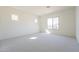 Bright, carpeted bedroom with natural light, and neutral colors at 6728 N 190Th Dr, Waddell, AZ 85355