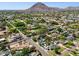 Expansive aerial view of a neighborhood with mature trees and stunning mountain backdrop at 6800 E Exeter Blvd, Scottsdale, AZ 85251