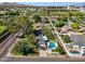 Aerial view of the property with the pool and detached garage at 6800 E Exeter Blvd, Scottsdale, AZ 85251