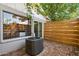 Backyard patio area with brick pavers, a sliding glass door, and a view of the outdoor unit at 6800 E Exeter Blvd, Scottsdale, AZ 85251
