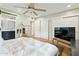 Bright bedroom with a ceiling fan featuring hardwood floors, and plenty of storage space at 6800 E Exeter Blvd, Scottsdale, AZ 85251