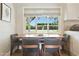 Cozy dining area with a large window offering scenic views of the outdoors and plenty of natural light at 6800 E Exeter Blvd, Scottsdale, AZ 85251
