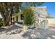 Exterior shot with a brick patio area with seating and a well-maintained garden at 6800 E Exeter Blvd, Scottsdale, AZ 85251