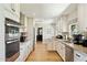 Modern kitchen featuring stainless steel appliances, granite countertops, and ample cabinet space at 6800 E Exeter Blvd, Scottsdale, AZ 85251