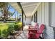 Inviting covered porch with chairs perfect for relaxing and enjoying the beautiful surroundings at 6800 E Exeter Blvd, Scottsdale, AZ 85251