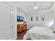 Modern bedroom with a comfortable bed, dresser, and cactus art pieces at 6803 E Main St # 5503, Scottsdale, AZ 85251