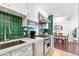 Beautiful kitchen with stainless steel appliances, quartz countertops, and views of the dining area at 6803 E Main St # 5503, Scottsdale, AZ 85251