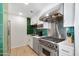 Modern kitchen with stainless steel appliances, white cabinets, and stylish backsplash tiles at 6803 E Main St # 5503, Scottsdale, AZ 85251