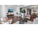 Open-concept living room with comfortable seating, modern decor, and views of the kitchen area at 6803 E Main St # 5503, Scottsdale, AZ 85251