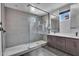 Modern bathroom features a large walk-in shower with grey subway tile and dual vanity at 687 W Flintlock Way, Chandler, AZ 85286