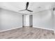 Neutral bedroom featuring wood-look floors and white doors at 687 W Flintlock Way, Chandler, AZ 85286