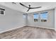 Bright bedroom with ceiling fan and three windows with blue sky views at 687 W Flintlock Way, Chandler, AZ 85286