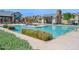 Large community pool with poolside seating and well-maintained landscaping in a residential neighborhood at 687 W Flintlock Way, Chandler, AZ 85286