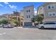 Exterior shot of modern townhomes with a tandem garage on a sunny day at 687 W Flintlock Way, Chandler, AZ 85286