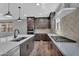 Gourmet kitchen featuring stainless steel appliances and a sleek cooktop with quartz countertops at 687 W Flintlock Way, Chandler, AZ 85286